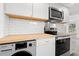 Stylish kitchen with butcher block counters, modern appliances, and sleek white cabinetry at 1004 Georgetown St., Marion, SC 29571