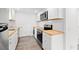 Modern kitchen featuring white cabinets, butcher block counters, and stainless steel appliances at 1004 Georgetown St., Marion, SC 29571