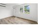 Cozy room featuring a large window, modern laminate flooring, and neutral paint at 1004 Georgetown St., Marion, SC 29571