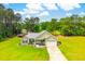 An aerial view of the inviting home showcasing its well-maintained lawn and charming curb appeal at 1013 Happy Ln., Galivants Ferry, SC 29544