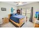 Comfortable bedroom with soft carpet, a ceiling fan, natural lighting, and traditional furnishings at 1013 Happy Ln., Galivants Ferry, SC 29544