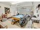 Spacious garage featuring a pool table, motorcycles, and ample storage space for hobbies and projects at 1013 Happy Ln., Galivants Ferry, SC 29544