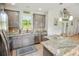 Well-lit kitchen with gray cabinetry, granite countertops, stainless steel appliances, and a breakfast bar at 1013 Happy Ln., Galivants Ferry, SC 29544