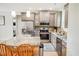 Modern kitchen featuring stainless steel appliances, gray cabinetry, granite countertops, and a center island at 1013 Happy Ln., Galivants Ferry, SC 29544