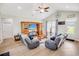 Inviting living room featuring a vaulted ceiling, hardwood floors, and a large entertainment center at 1013 Happy Ln., Galivants Ferry, SC 29544