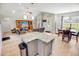 Open concept living room featuring vaulted ceilings, modern decor, and seamlessly connecting to the kitchen and dining areas at 1013 Happy Ln., Galivants Ferry, SC 29544