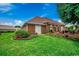 Spacious backyard with a brick patio and manicured lawn at 1017 Coral Reef Dr., North Myrtle Beach, SC 29582