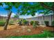 Secluded backyard space with a hammock, seating, and mature trees at 1017 Coral Reef Dr., North Myrtle Beach, SC 29582