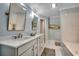 Beautiful bathroom with double vanity, marble countertops, and a soaking tub at 1017 Coral Reef Dr., North Myrtle Beach, SC 29582