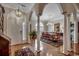 Elegant dining room featuring hardwood floors, decorative columns, and a chandelier at 1017 Coral Reef Dr., North Myrtle Beach, SC 29582