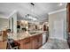 Spacious kitchen featuring granite countertops, a large island, and stainless-steel appliances at 1017 Coral Reef Dr., North Myrtle Beach, SC 29582