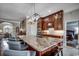 Gourmet kitchen with granite island, custom cabinets, and stainless-steel appliances at 1017 Coral Reef Dr., North Myrtle Beach, SC 29582