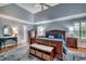 Elegant main bedroom with blue walls, a vaulted ceiling, and plenty of natural light at 1017 Coral Reef Dr., North Myrtle Beach, SC 29582