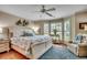 Cozy bedroom with hardwood floors, a ceiling fan, and natural light from the windows at 1017 Coral Reef Dr., North Myrtle Beach, SC 29582