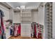 Organized walk-in closet with shelves, drawers, and hanging rods for maximum storage capacity at 1017 Coral Reef Dr., North Myrtle Beach, SC 29582