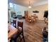 Open-concept dining area features wood floors and a table set for four at 1048 Fairway Ln. # 1048, Conway, SC 29526