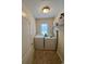 Functional laundry room with washer, dryer, and built-in shelving for storage at 1048 Fairway Ln. # 1048, Conway, SC 29526