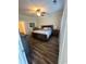 Bedroom with wood floors, neutral walls, ceiling fan, and en-suite bathroom at 1048 Fairway Ln. # 1048, Conway, SC 29526
