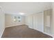 Spacious bedroom featuring carpet, a double door closet, window, and neutral walls, creating a comfortable retreat at 109 Plum Ln., Andrews, SC 29510