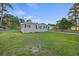 Charming single-story home with a fenced yard, complemented by lush green grass at 109 Plum Ln., Andrews, SC 29510