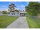 Charming single-story home with a fenced yard, driveway, and covered porch at 109 Plum Ln., Andrews, SC 29510