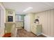 Well-lit kitchen featuring hardwood floors, stylish cabinetry, and an adjacent breakfast bar at 109 Plum Ln., Andrews, SC 29510