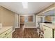 Open kitchen view showcasing wood flooring, natural light, breakfast bar, and seamless flow into the living spaces at 109 Plum Ln., Andrews, SC 29510