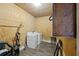 Functional laundry room featuring a washer, dryer, and storage space with laminate flooring at 109 Plum Ln., Andrews, SC 29510