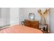 Cozy bedroom featuring a wooden dresser and stylish decor at 1101 Possum Trot Rd. # D201, North Myrtle Beach, SC 29582