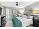 Cozy bedroom with grey walls, decorative mirrors, a ceiling fan, and plenty of natural light at 1101 Possum Trot Rd. # D201, North Myrtle Beach, SC 29582