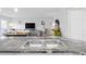 A gourmet kitchen offers sleek countertops, modern stainless steel appliances and ample natural light at 1101 Possum Trot Rd. # D201, North Myrtle Beach, SC 29582