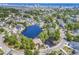 Overhead captures homes nestled around a scenic lake, with an amazing view of the ocean on the horizon at 1108 Surf Pointe Dr., North Myrtle Beach, SC 29582