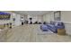 The finished basement features a workout area, seating, and built-in storage for a versatile living space at 1108 Surf Pointe Dr., North Myrtle Beach, SC 29582