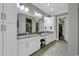 A luxurious bathroom includes dual sinks with granite countertops and a walk-in shower with a built-in seat at 1108 Surf Pointe Dr., North Myrtle Beach, SC 29582