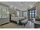 A spacious main bedroom boasts tray ceilings, a sitting area, and access to a private balcony with water views at 1108 Surf Pointe Dr., North Myrtle Beach, SC 29582