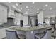 This open kitchen offers lots of white cabinets, granite countertops, stainless steel appliances, and recessed lighting at 1108 Surf Pointe Dr., North Myrtle Beach, SC 29582