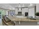 Open kitchen featuring a large breakfast bar with granite countertops, stainless steel appliances, and eat-in kitchen at 1108 Surf Pointe Dr., North Myrtle Beach, SC 29582