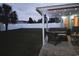 Outdoor patio area with a seating area, lights, and a beautiful lush, green lawn at 1205 Cymmer Ct., Conway, SC 29527