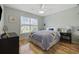 Inviting bedroom with ceiling fan, bright window, and wood floors at 1205 Cymmer Ct., Conway, SC 29527