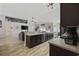 Modern kitchen boasts stainless steel appliances, dark cabinets, and an open floor plan at 1205 Cymmer Ct., Conway, SC 29527