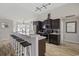 Stylish kitchen with breakfast bar seating, stainless appliances, and wooden floors at 1205 Cymmer Ct., Conway, SC 29527