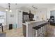 Bright kitchen with breakfast bar, stainless steel appliances, and wood floors at 1205 Cymmer Ct., Conway, SC 29527