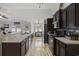 Contemporary kitchen with stainless steel appliances and dark cabinets at 1205 Cymmer Ct., Conway, SC 29527