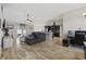 Open-concept living room flowing into kitchen, featuring hardwood floors at 1205 Cymmer Ct., Conway, SC 29527
