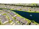 An aerial view showcases a community of homes surrounding a lake with a fountain feature at 121 Parmelee Dr. # D, Murrells Inlet, SC 29576