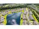 Aerial view of neighborhood with homes surrounding a tranquil lake with a water feature at 121 Parmelee Dr. # D, Murrells Inlet, SC 29576