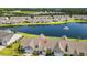 An aerial view showcases the home overlooking a serene lake with a fountain feature at 121 Parmelee Dr. # D, Murrells Inlet, SC 29576
