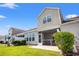 Exterior elevation with a well manicured lawn, screened porch, and pleasant backyard view at 121 Parmelee Dr. # D, Murrells Inlet, SC 29576