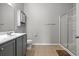 Bathroom featuring a double sink, shower with glass doors, and neutral walls at 121 Parmelee Dr. # D, Murrells Inlet, SC 29576