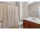 Bathroom showcasing a toilet, shower and wood vanity with a white sink at 121 Parmelee Dr. # D, Murrells Inlet, SC 29576